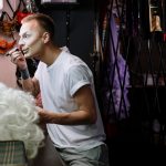 Drag queen applying makeup